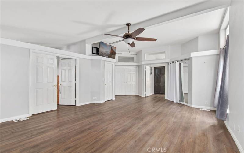 Primary bedroom with double door entry, 2 walk-in closets, and an office/retreat to the left.