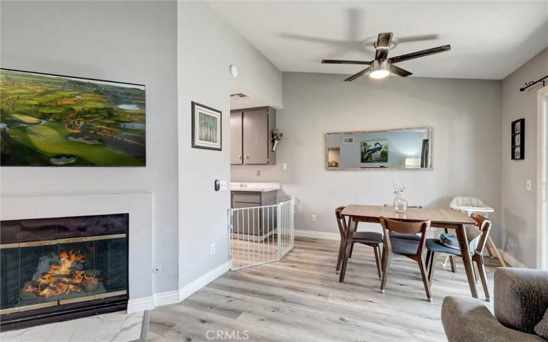 Dining Space with Ceiling Fan. Image on tv screen & fire have been digitally added.