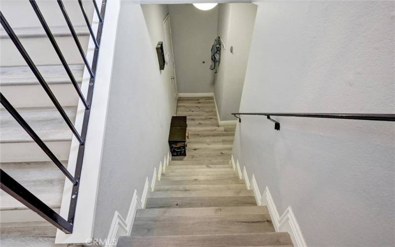 Stairs leading to Front Door & Direct access to Garage