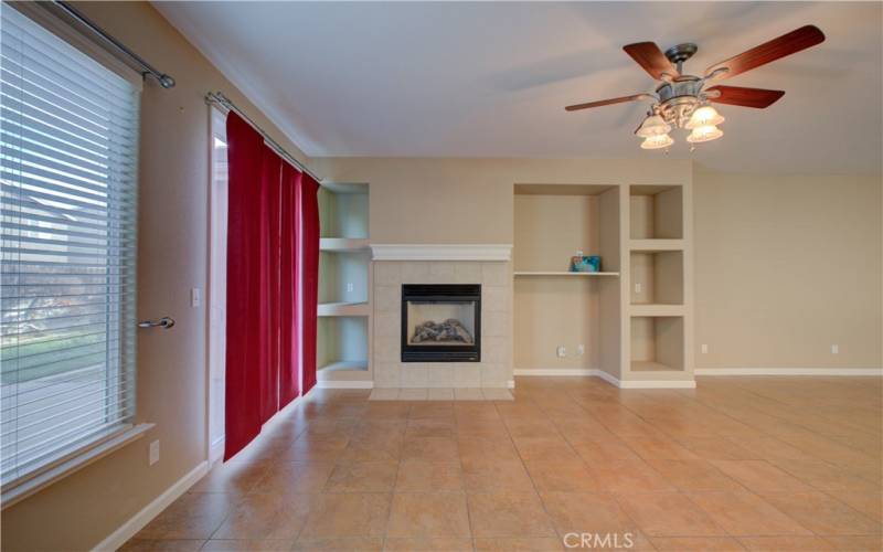 family room with back door and fireplace