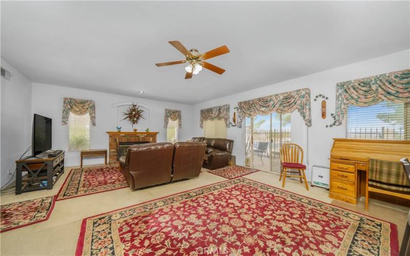 Family room/living room with fireplace. Opens up to kitchen