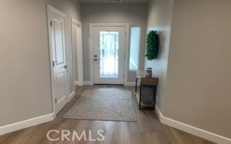 View of spacious entry way, leaded glass front door overlooking covered front porch.