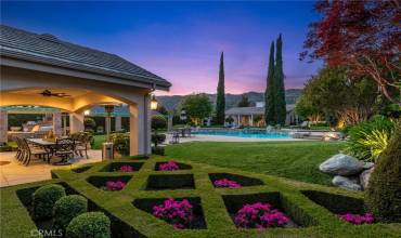 Exquisite landscaping overlooking the impeccable backyard.