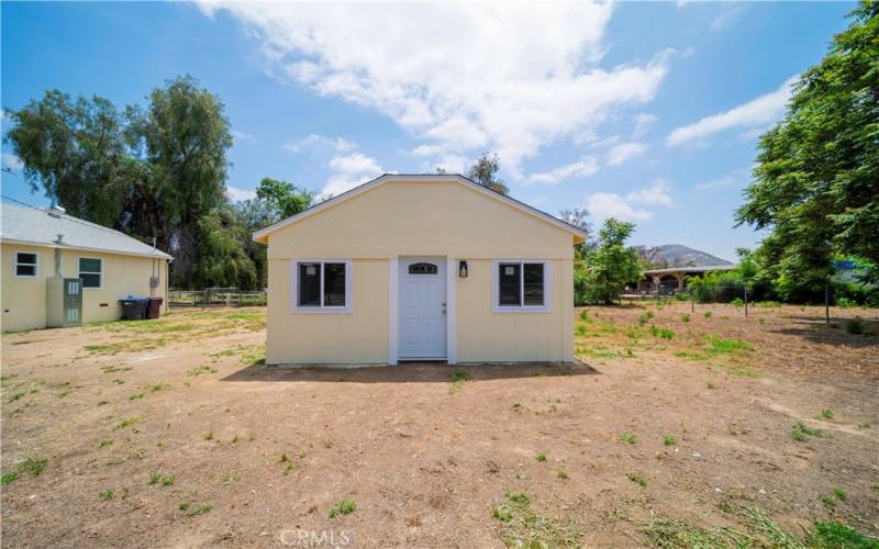 Bonus room with 2-car garage on backside. Huge yard! Middle yard on the left and back yard extends to the right.