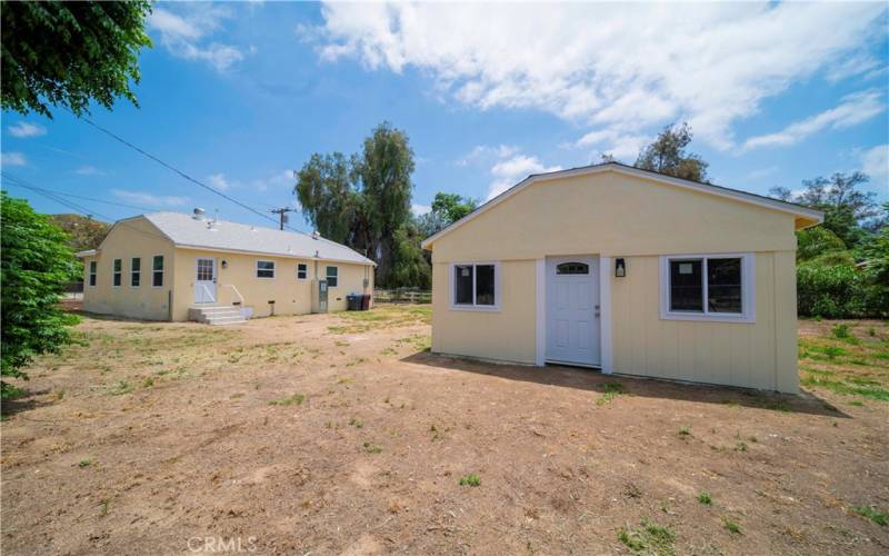 Bonus Room and house with mid yard in between.