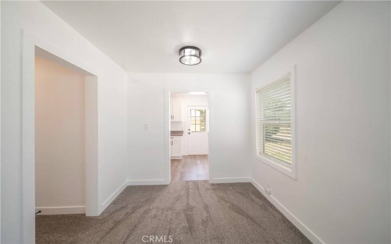 Dining area, Go left to bedrooms and straight ahead to kitchen and backyard access.