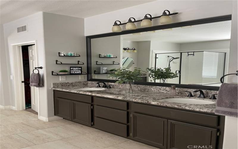 Master Bathroom with 2 walk-in closets (his and hers)