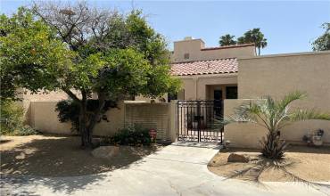 Courtyard Entry with Paver and French door iron gate