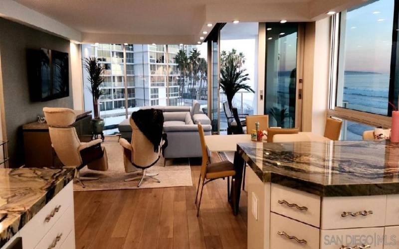 Beautifully remodeled living/ dining/ kitchen area. Note the oceanfront balcony on the corner- SPECTACULAR!