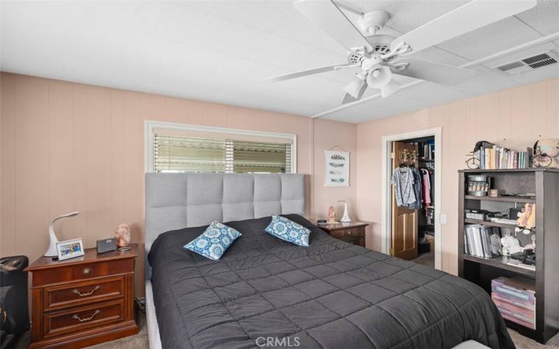 Primary bedroom with walk in closet