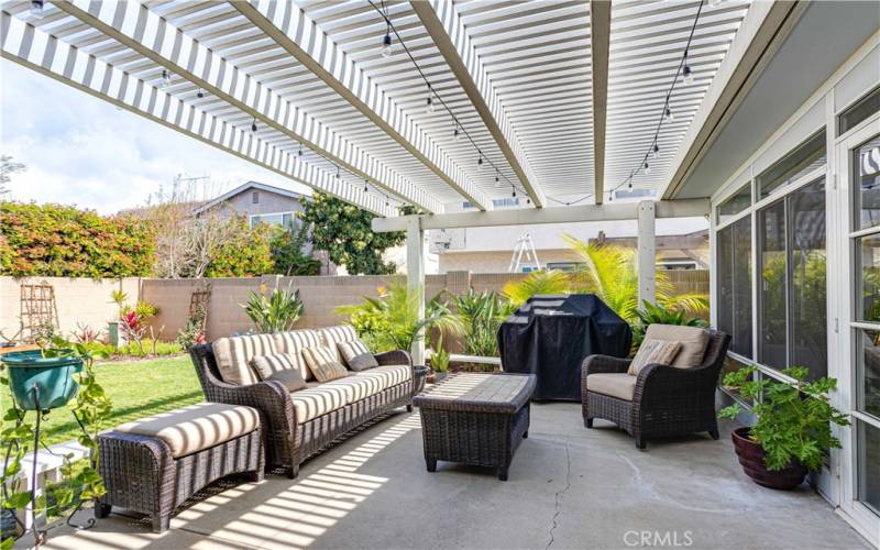 Backyard patio with pergola & built in seating