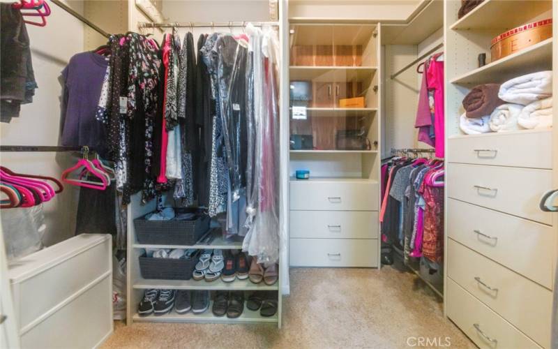 Large Walk-In Closet in primary Bath has nice built-in shelving and cabinets