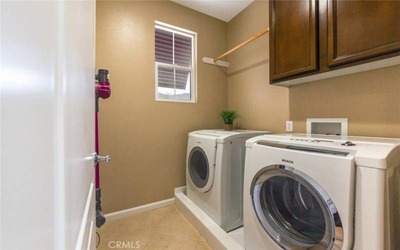 Indoor Laundry located in hallway to  Office has 2 storage cabinets