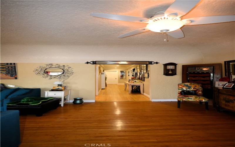 You can see the hallway leading to the private areas of the home.