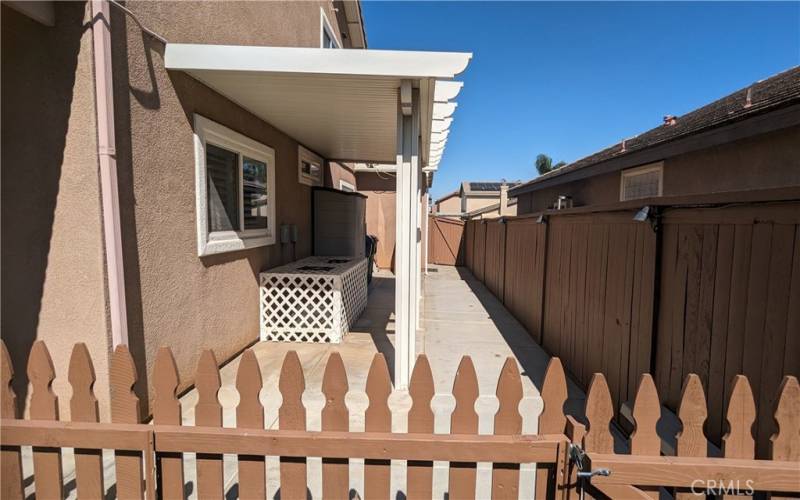 Gated Side Patio provides additional shade and also protects the A/C Units.