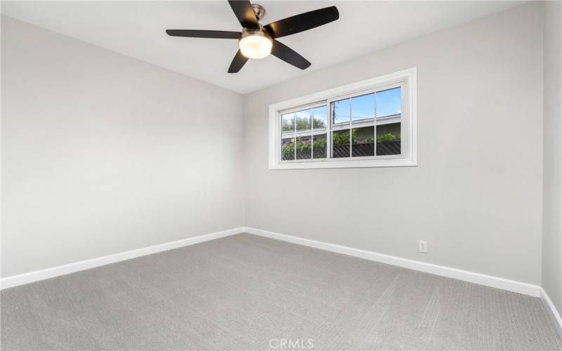 Enjoy scraped ceilings with ceiling fans and new carpet in the secondary bedrooms!