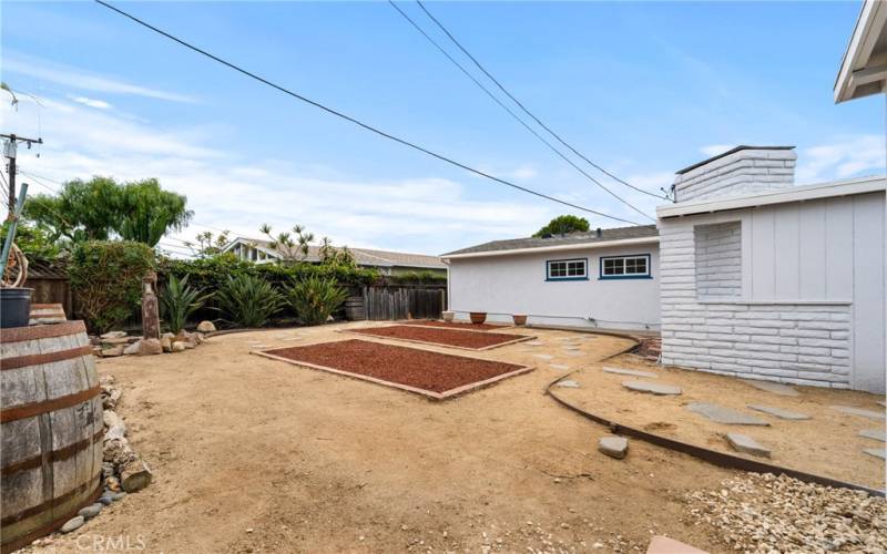 Enjoy the spacious backyard, ideal for hosting gatherings and family activities. Possibly room for an ADU