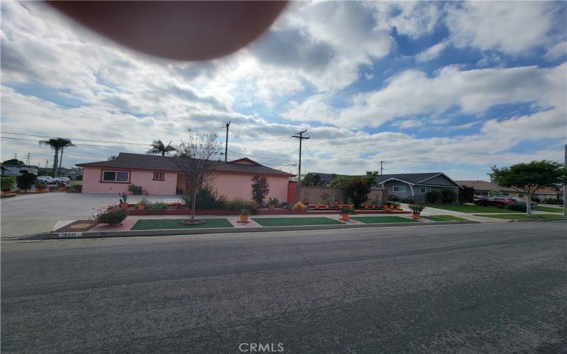 Front of the house with beautiful curb appeal with beatiful eyes pleasing flowers