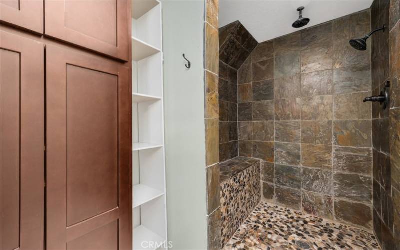 Extra storage and Walk in shower with dual heads and controls