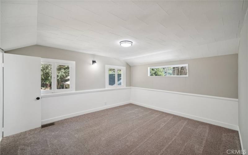 Primary bedroom with walk-in closet