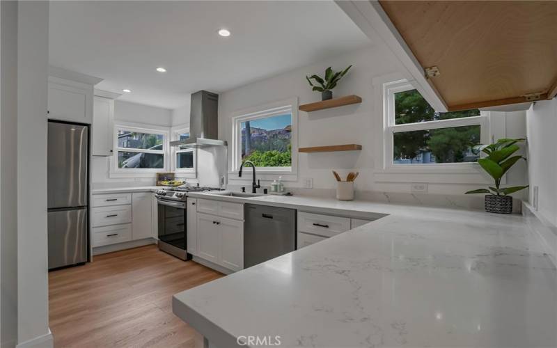 Your kitchen offers plenty of natural lighting and a view of the neighborhood.