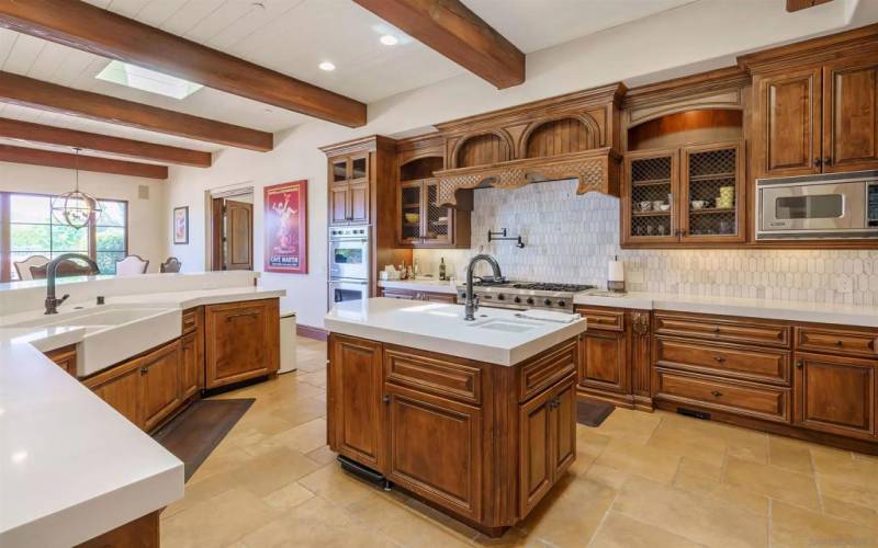 Great farm sink and updated counters , and gorgeous custom back splash.