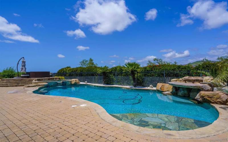 Gorgeous resort style pool. with paver decking