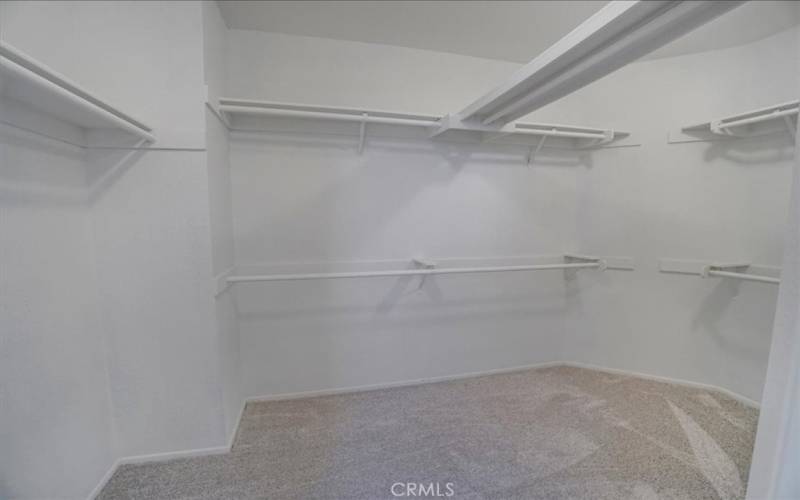 Interior view of a walk-in closet, view 1