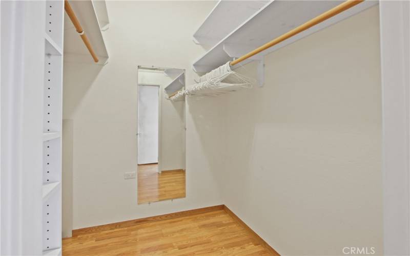 Primary bedroom walk in closet.