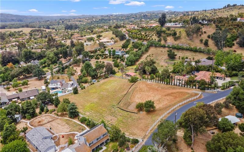 Paved City Streets, Hill and Valley Views and Fresh cool citrus breezes adore this great property. Plenty of room to customize every inch of your New Build.