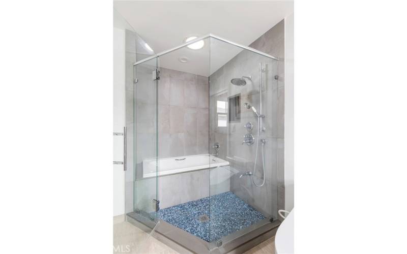 Primary tub/shower with tile floor