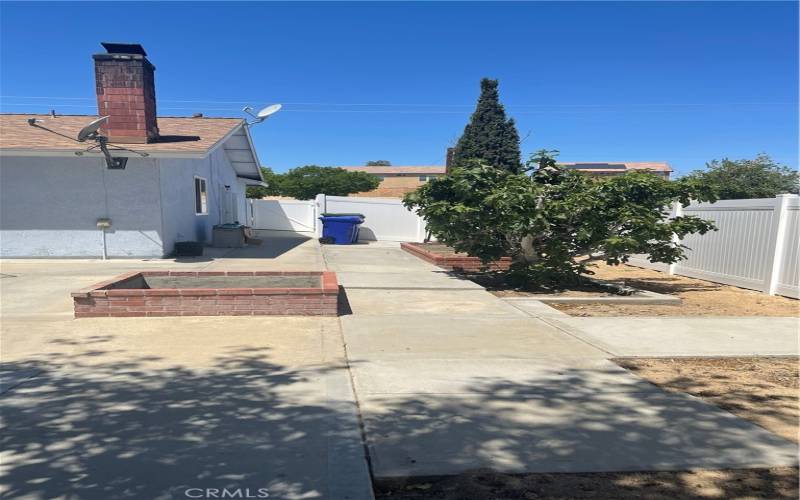 Left side of the property facing front of the house