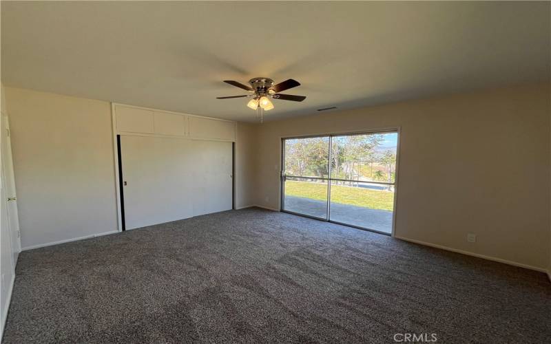 2nd bedroom has large closet and it's own slider, new carpet and ceiling fan