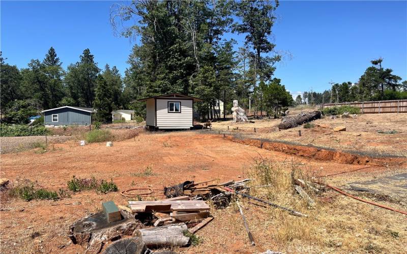 Cleared lot ready for building. Shed with Hot water.