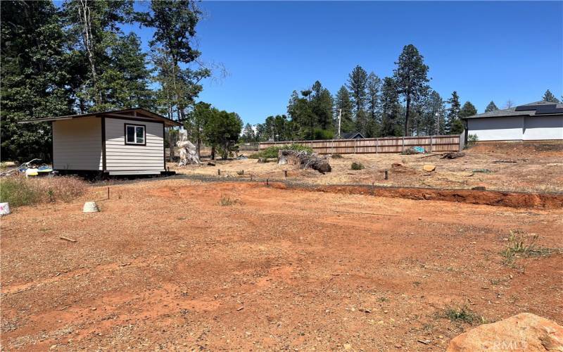 Leveled lot and shed.