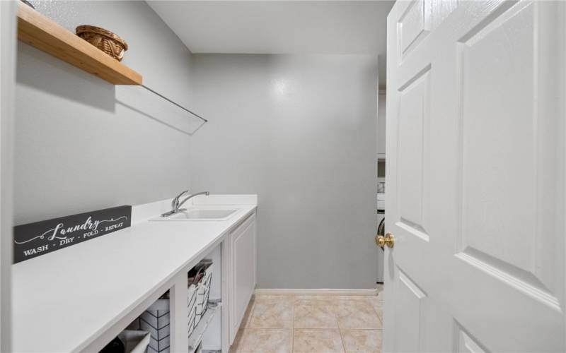 Individual laundry room with sink