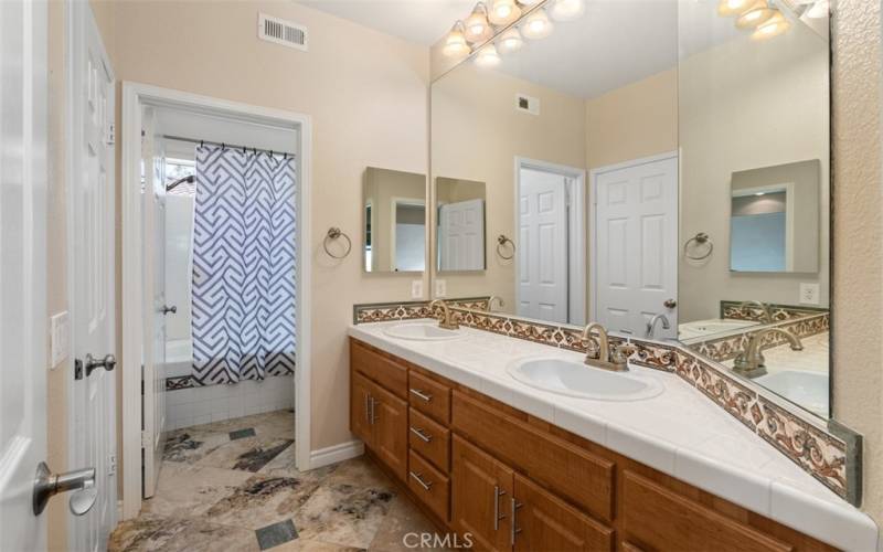 Bathroom w/Double Sinks & Separate Shower Area