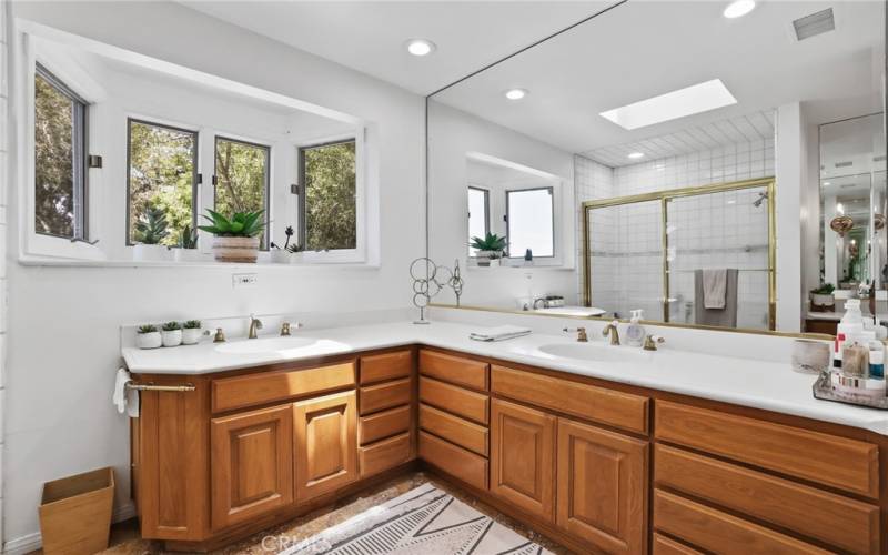 Hall bath features dual sinks and large counter spaces