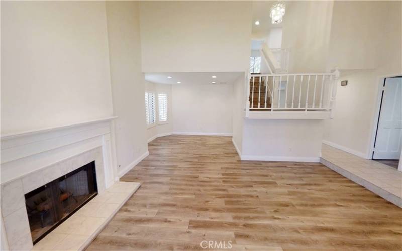 Living room with view of formal dining room, entry and stairs