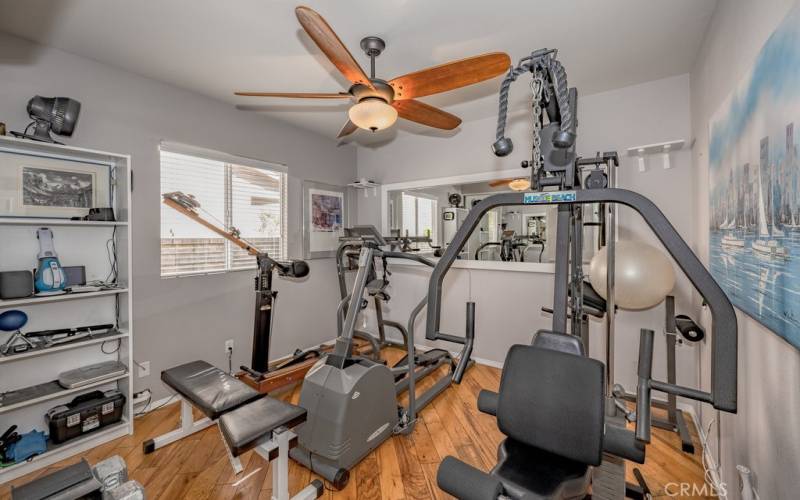 THIS BEDROOM IS BEING USED AS A WORKOUT ROOM.