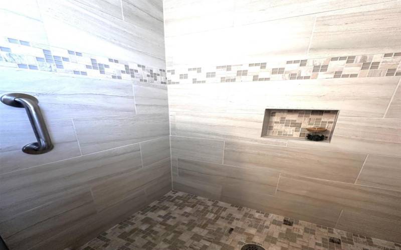 up close tile shower in primary bath
