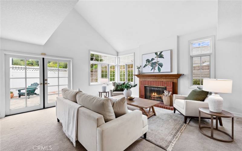 Bright & open Living room with lots of windows & high ceilings.