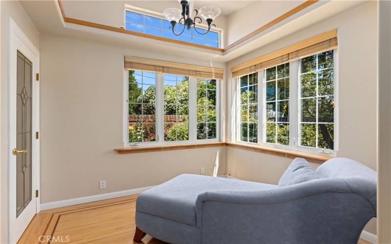 Primary bedroom sitting area. Walk-in closet to the left.