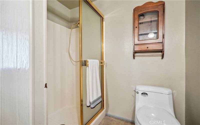 Primary Bathroom #1 with vanity and stall shower.