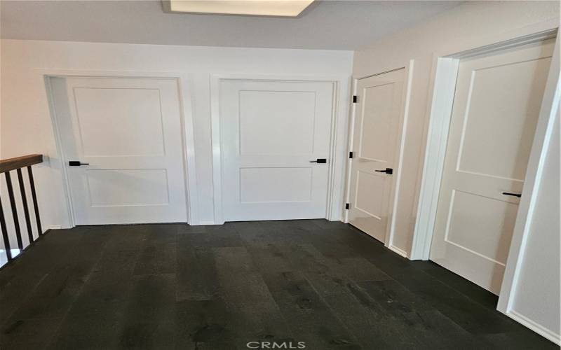Upstairs with hardwood flooring and Updated interior doors and hardware throughout