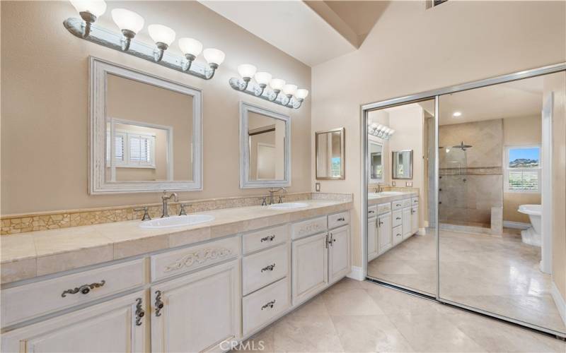 Behind the mirrored doors is a walk-in closet!