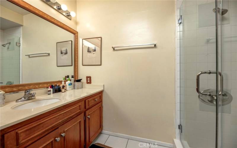 Hallway bathroom with shower.