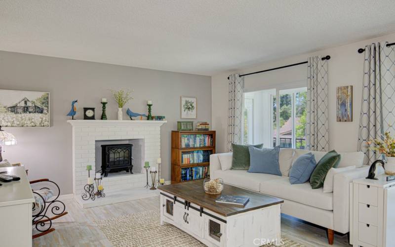 Living room features a wood-burning fireplace.