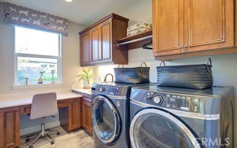 Laundry room with sink and workspace.