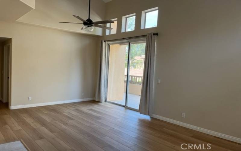 Combo living/dining area with access to balcony
